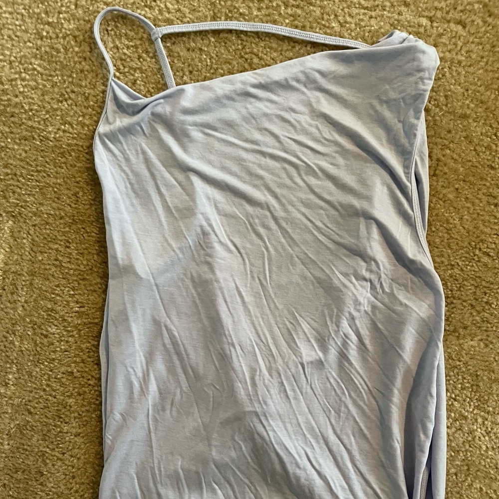 Lululemon size 4 tank top. Knot in lower back with open back feel.